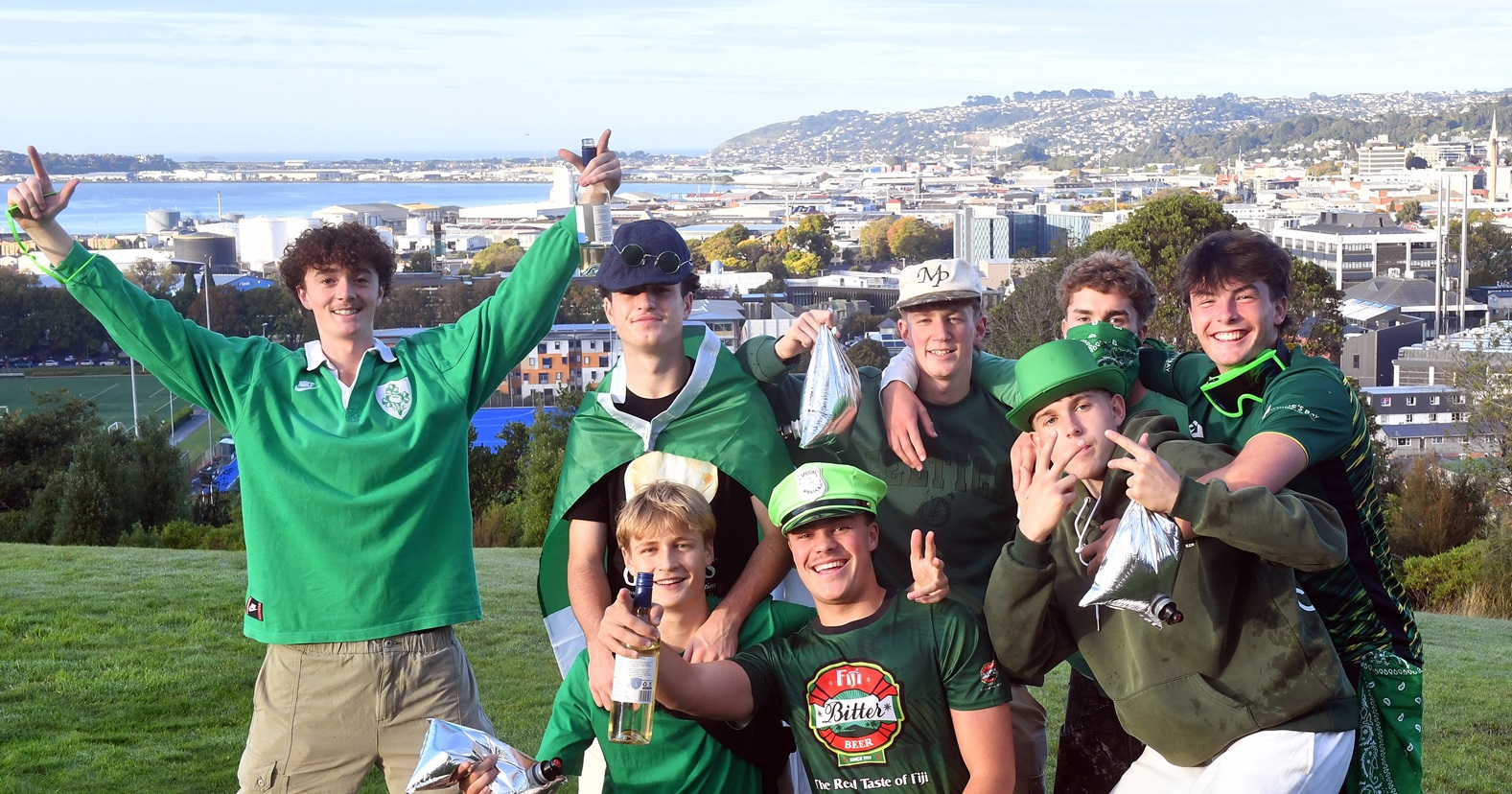 A group of revellers are treated to a clear view of Dunedin City at Brackens Lookout.

