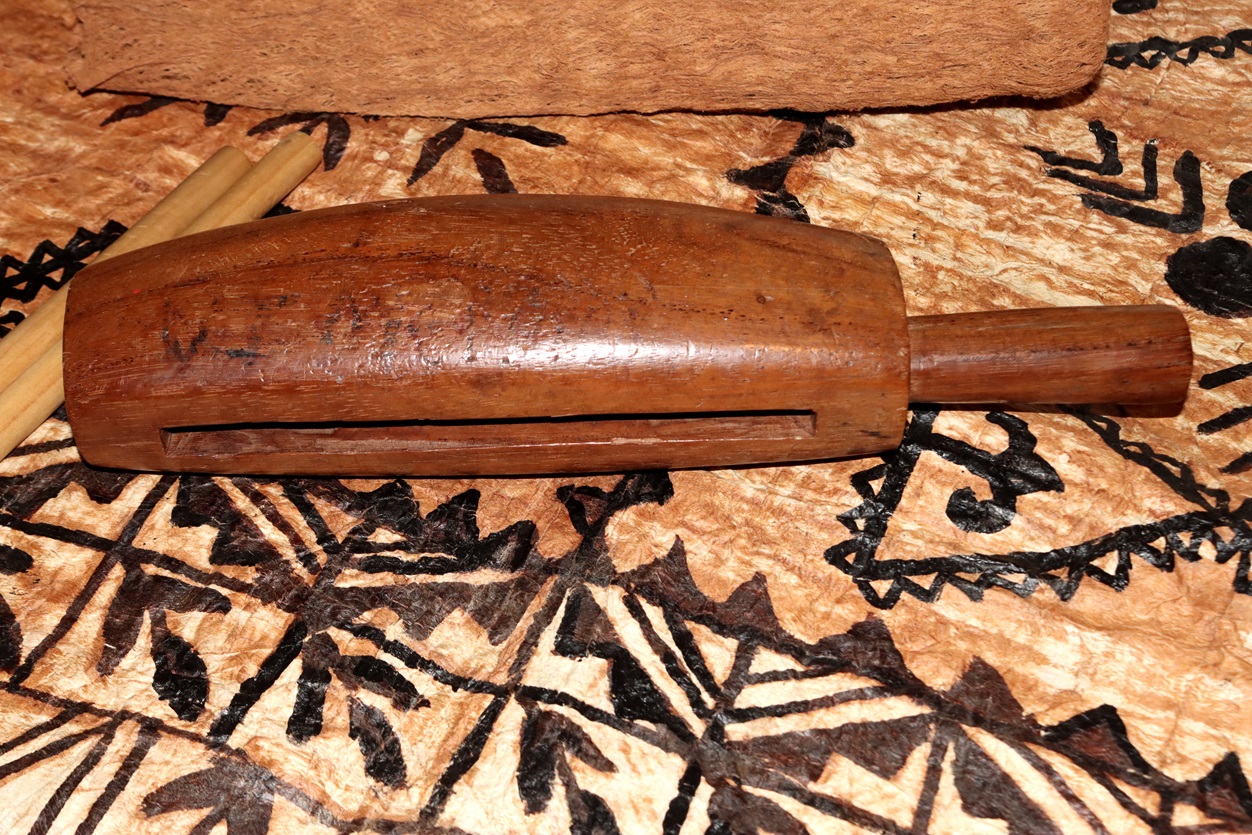 A carved musical instrument has different sounds depended on where it is struck.

