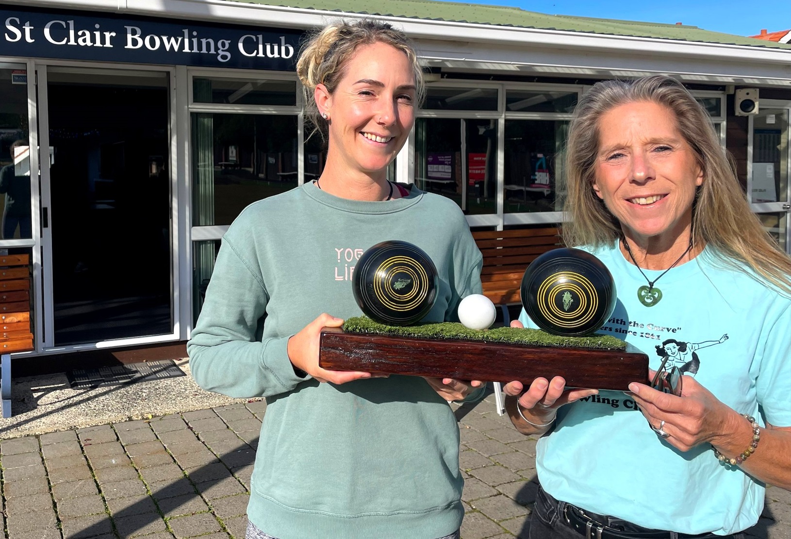 St Clair Bowling Club players Jenna McLaughlin (left) and Mary Ellen Copland display the Twilight...