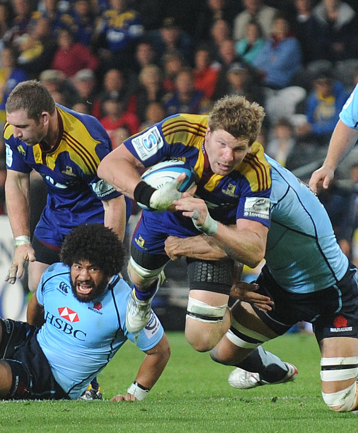 Highlanders flanker Adam Thomson throws himself at the Waratahs defence during a Super Rugby game...