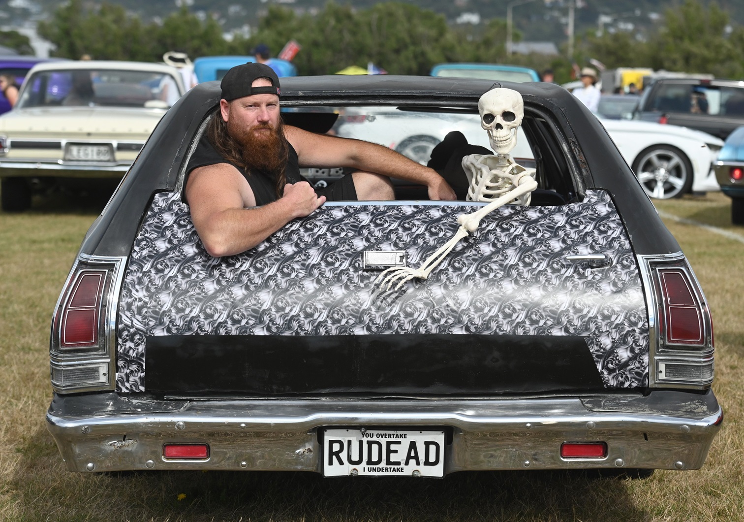 Axl Tilden, of Dunedin, had a bony companion in his Halloween-themed 1975 Plymouth Fury at last...