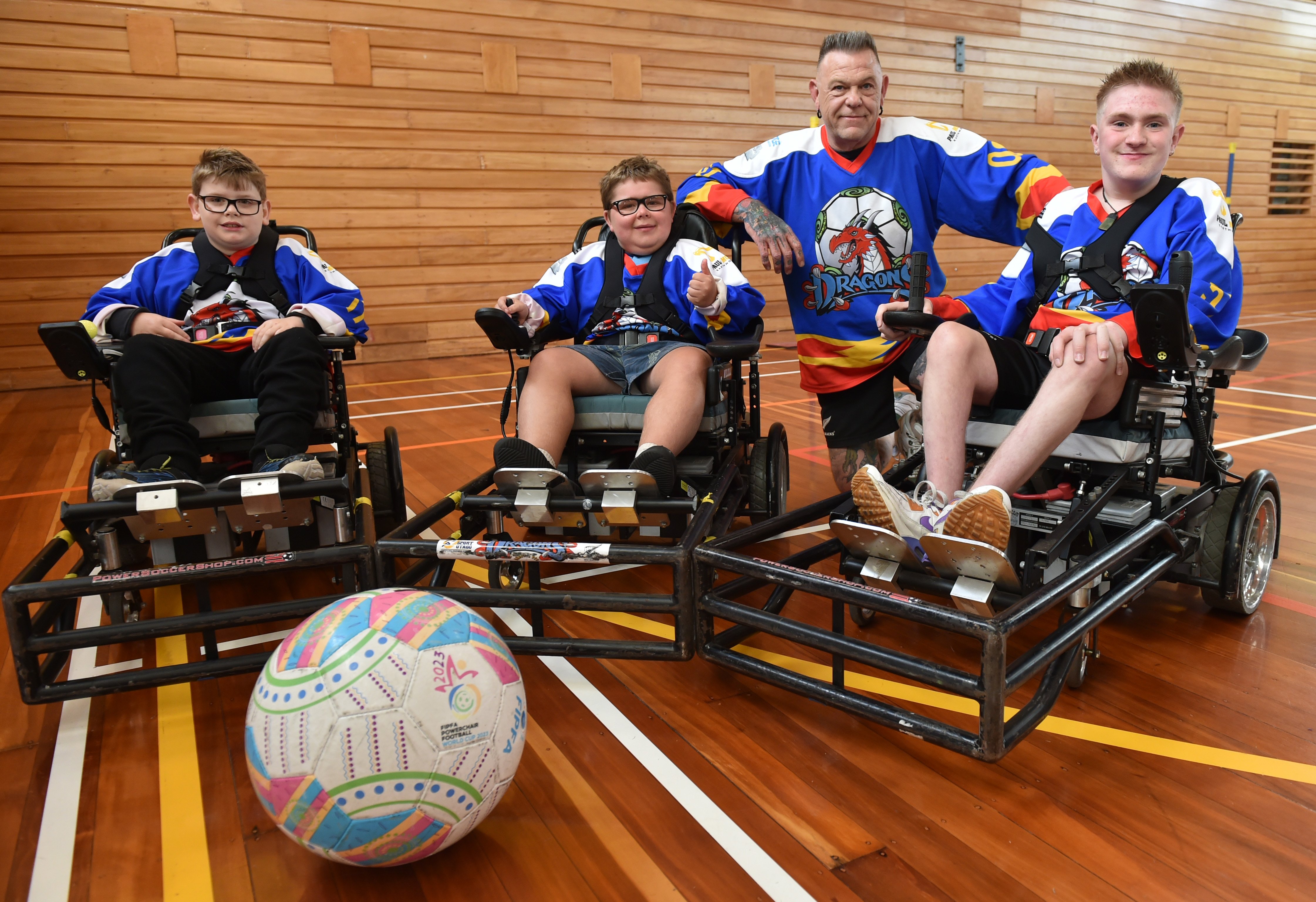 Dunedin Dragons Powerchair Football Club members (from left) Harrison Carter, 9, Stanley Smith,...