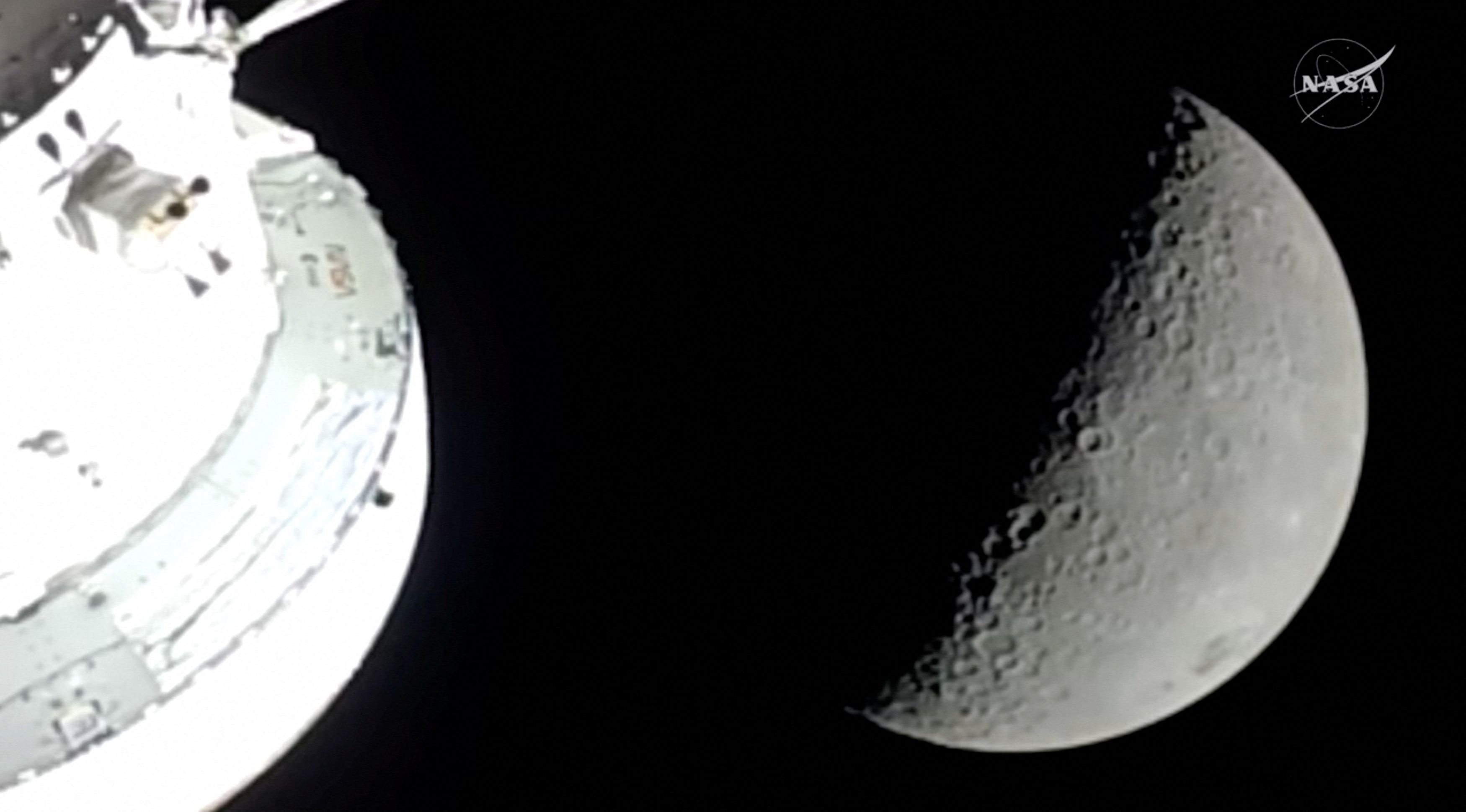 The moon is seen from a camera outside the Orion spacecraft after the Artemis II astronauts...