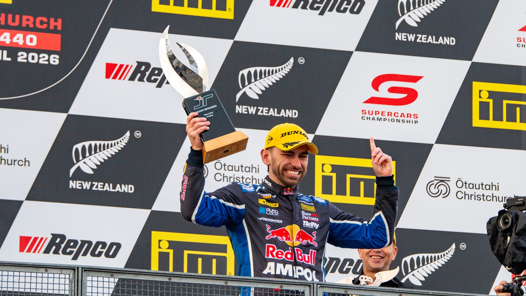 Broc Feeney hoisting the Jason Richards Memorial Trophy.