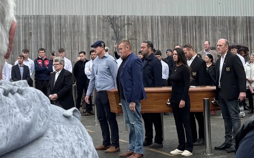 Shane Christie's coffin being carried into the funeral service. Photo: RNZ 