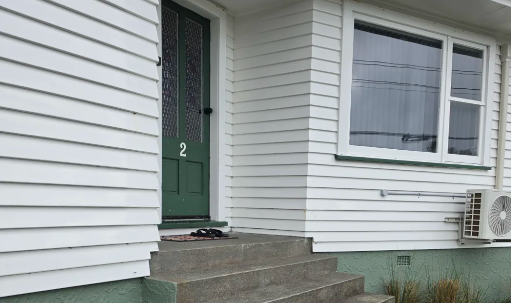 The stairs that Dinson Thomas has to carry his daughter up in order to get inside their home....