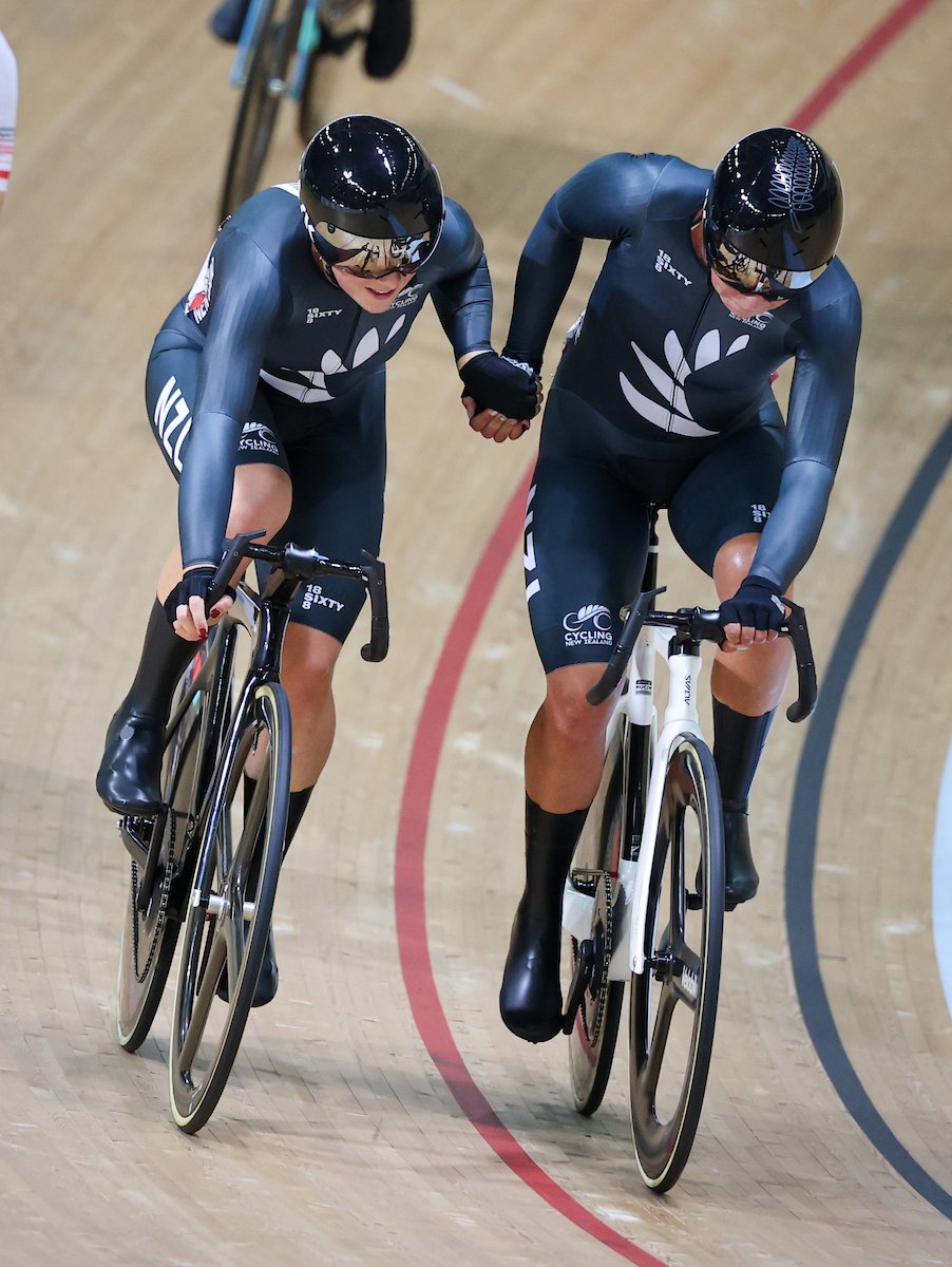 New Zealand cyclist Bryony Botha (right) changes with team-mate Prudence Fowler in the two-rider...
