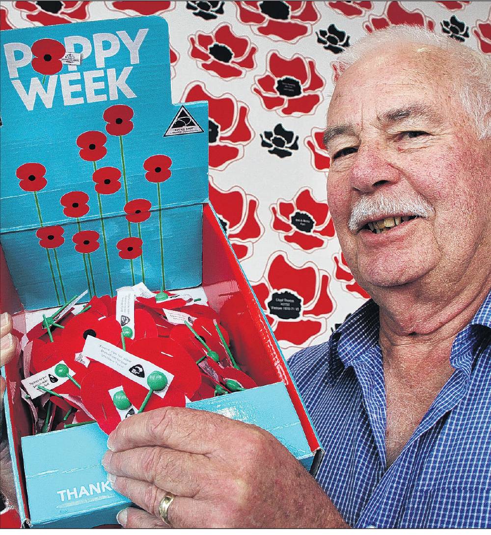 Don Joblin with a box of poppies for this year’s annual RSA fundraiser. Many more have been...