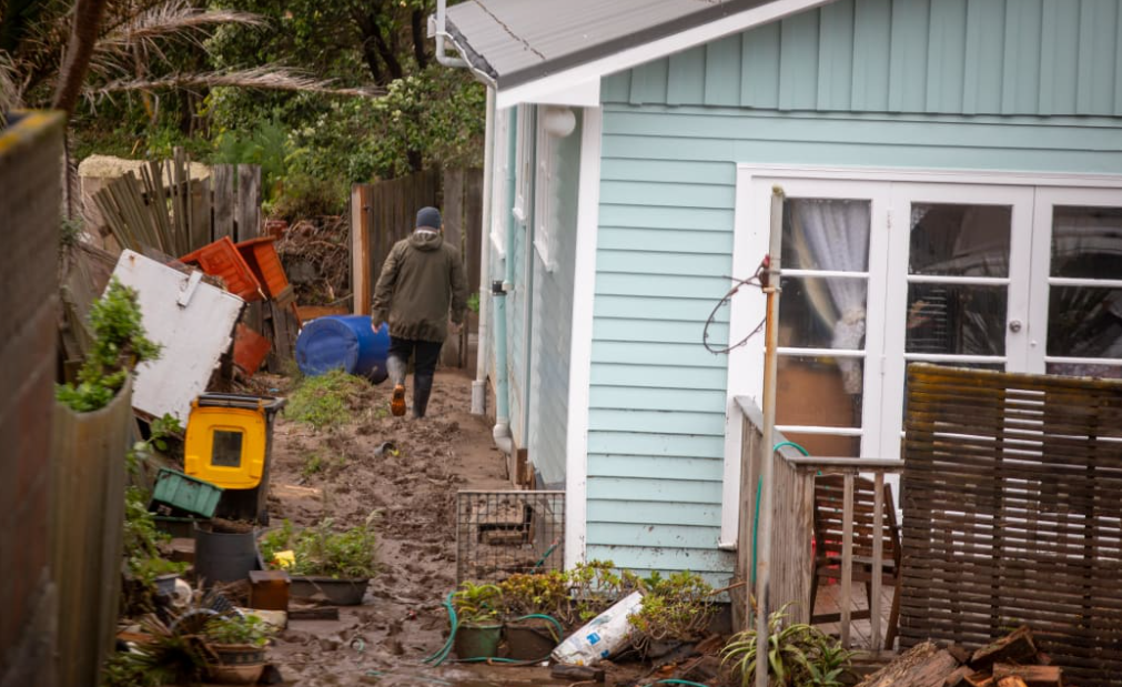 Mud and silt surrounds the Ōwhiro Bay home. Photo: RNZ