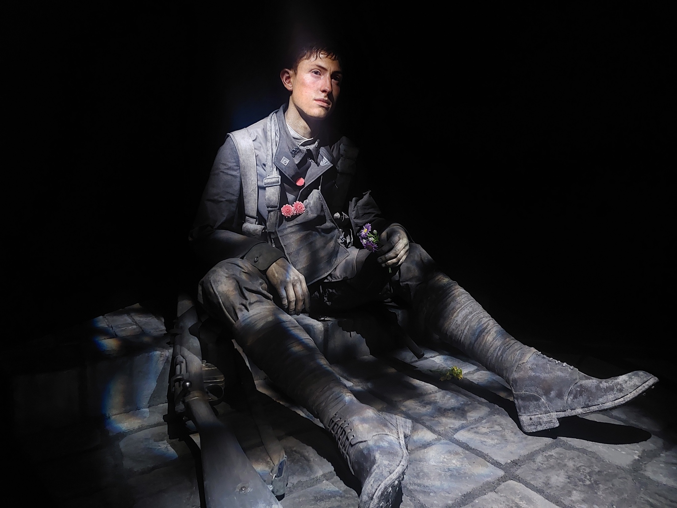 Crafted in bronze and 2.4 times the size of a normal man, the New Zealand soldier sits exhausted...