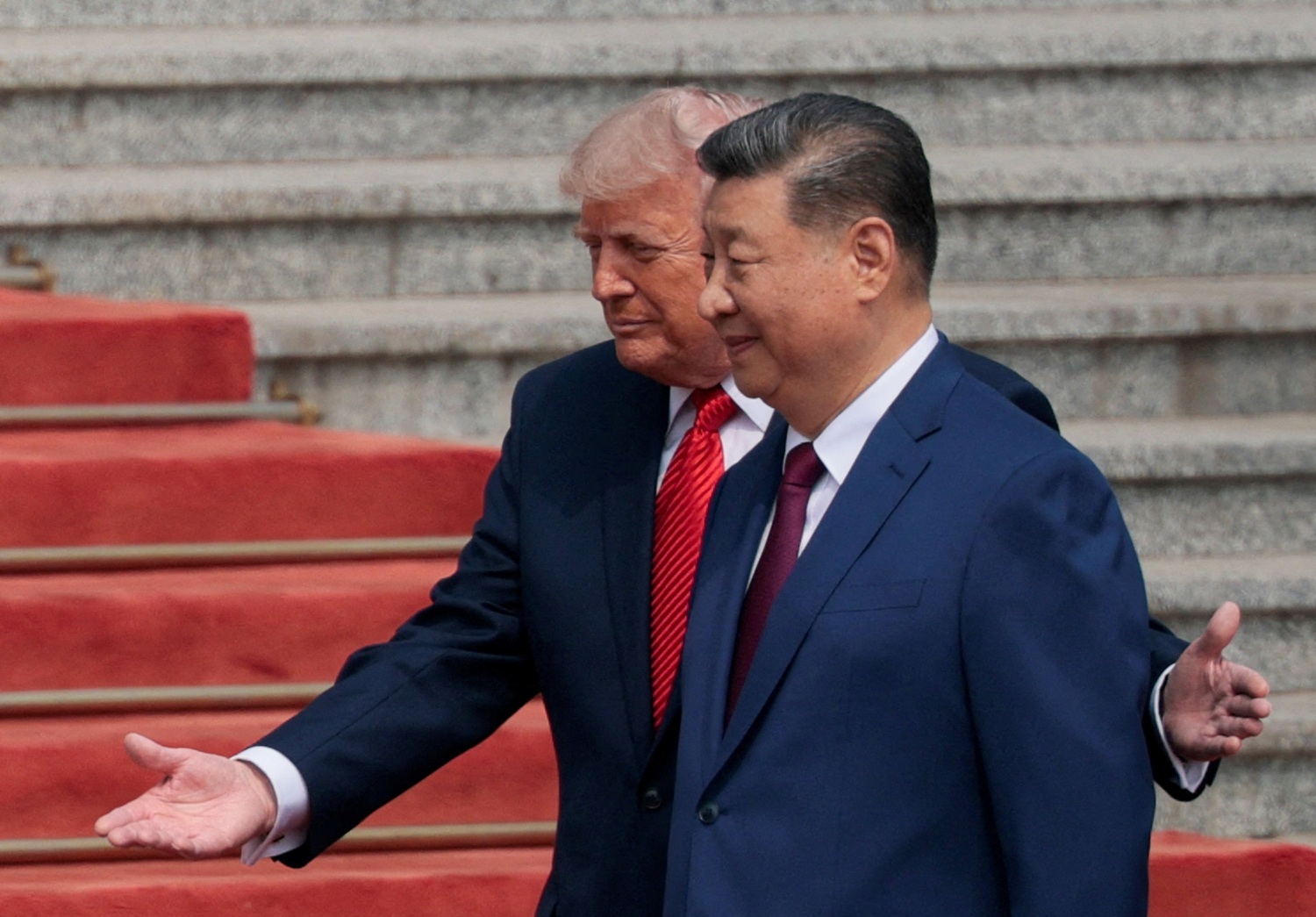 US President Donald Trump participates in a welcome ceremony with Chinese President Xi Jinping at...