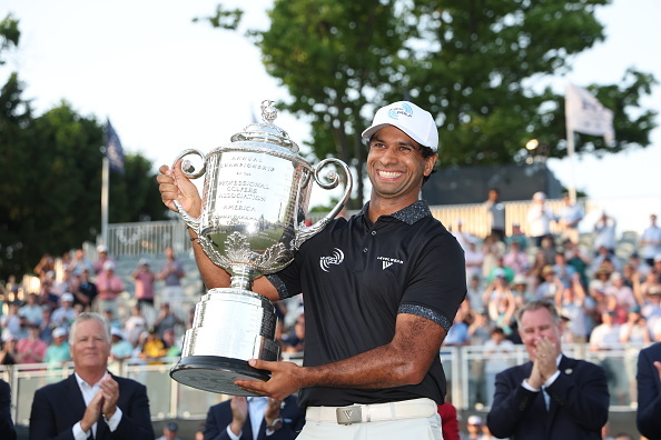Aaron Rai celebrates with The Wanamaker Trophy after winning during the final round of the PGA...