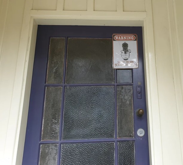 A notice on the door of Troy Dubovskiy's St Martin's house. Photo: Karen Brown