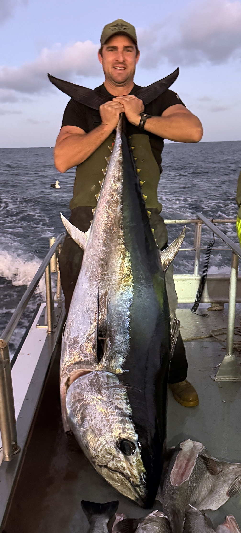 Trent Anderson with the 125.7kg bluefin tuna he caught off the Dunedin coast last Friday. PHOTO:...