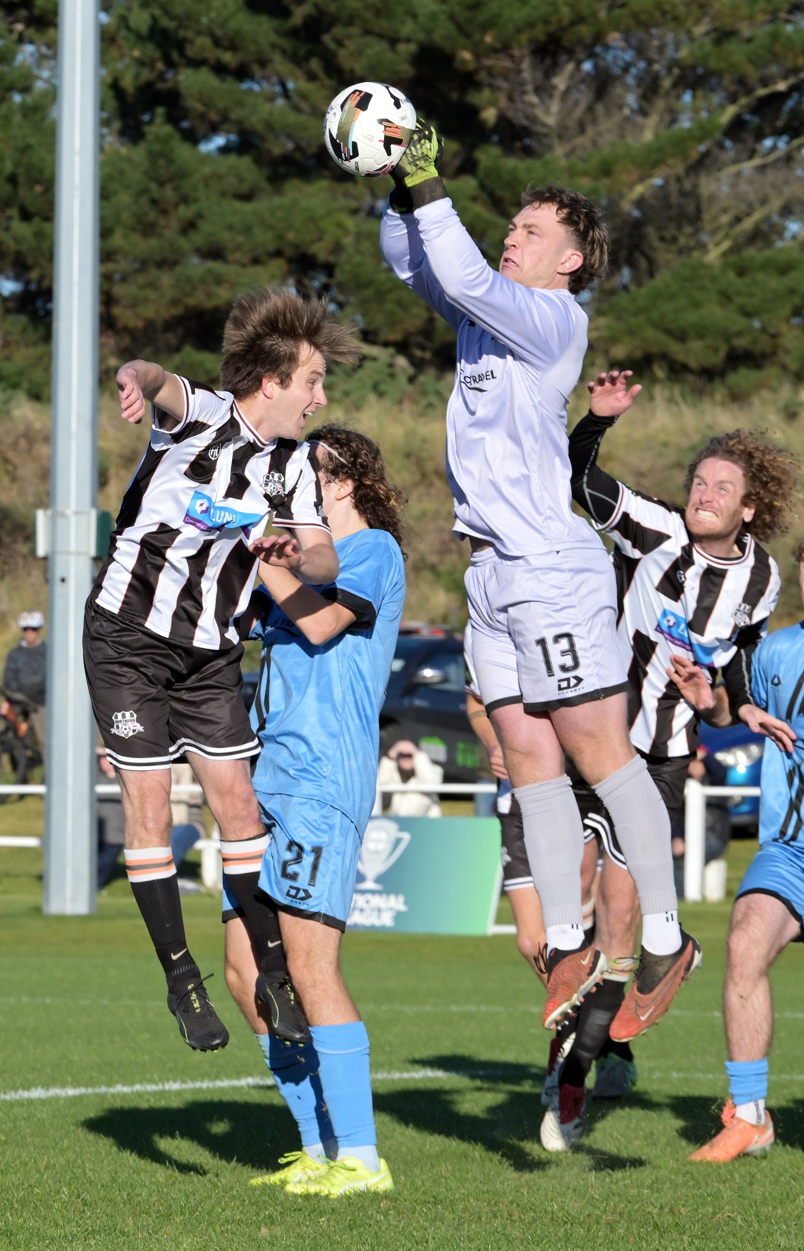 Dunedin City Royals goalkeeper Alex Boomer fends off a corner kick during their clash against...