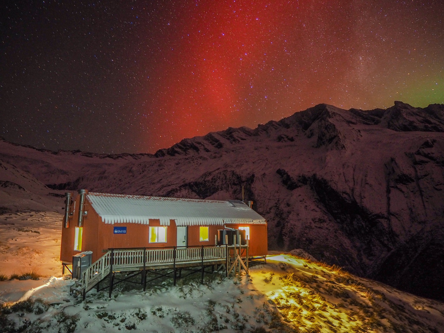 The Aurora Australis over French Ridge Hut in Mount Aspiring National Park captured by Doc...
