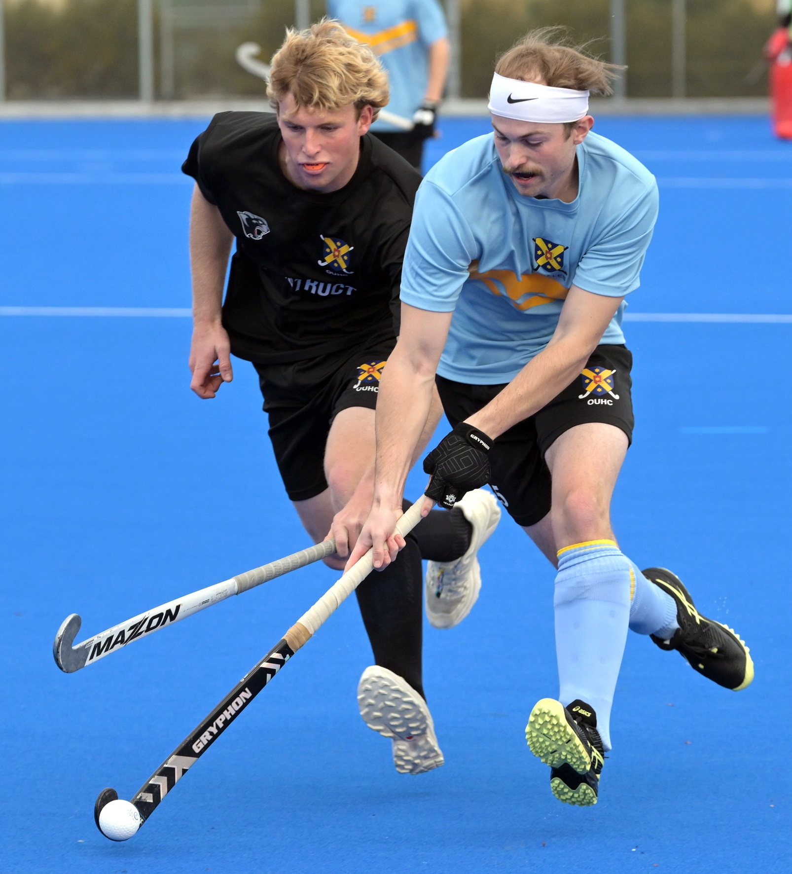 Sam Gradwell (Otago University Whales) has William Matthews (Otago University Panthers) on his...
