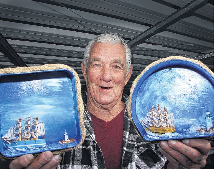 Waikuku Beach artist Mick Watt in his studio surrounded by his nautical art works. PHOTO: JOHN...