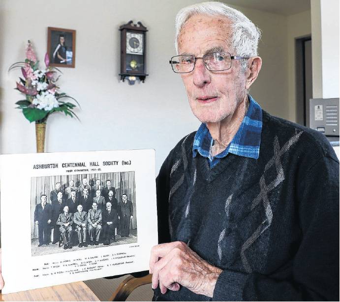 Gordon Clinton with a photo of the 1954 founding committee of the Ashburton Centennial Sports...