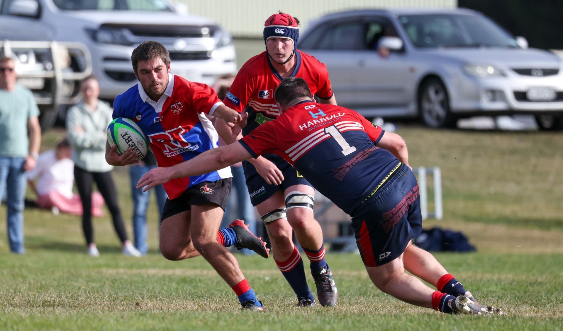 Maniototo halfback Ben Maxwell evades the tackle of Cromwell prop Alex Chubb during the Central...