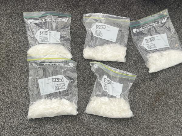 Five bags of methamphetamine, each about 200 grams, were seized during search warrants in...