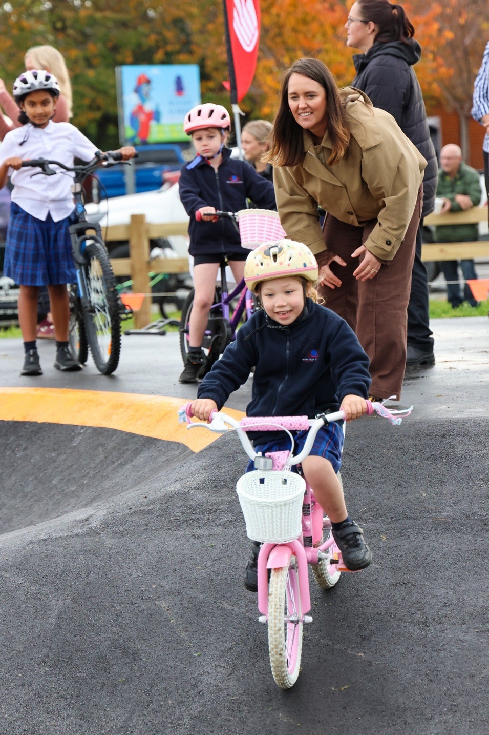Winton Primary School teacher Mel Brunell watches carefully over Maci Wright, 5, at the pump...