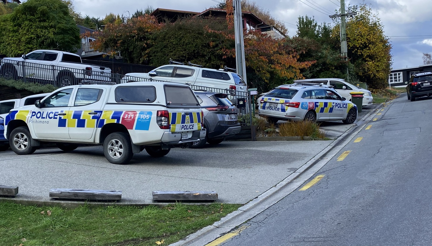 Police vehicles surround a house in Hallenstein St in Queenstown following a serious assault....