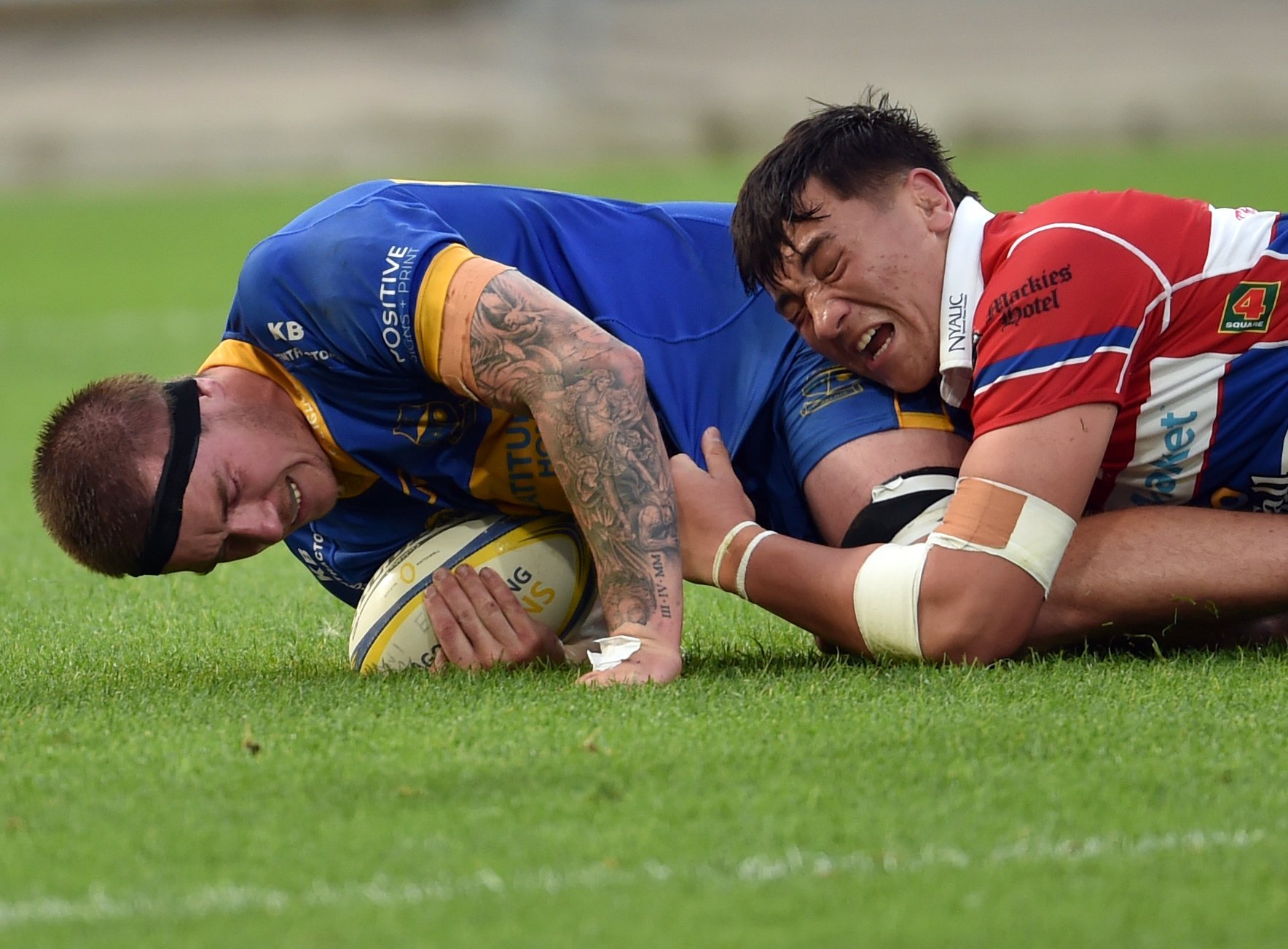 Taieri lock Harvey Amende is tackled by Harbour lock Preston Moananu during a division 1 club...
