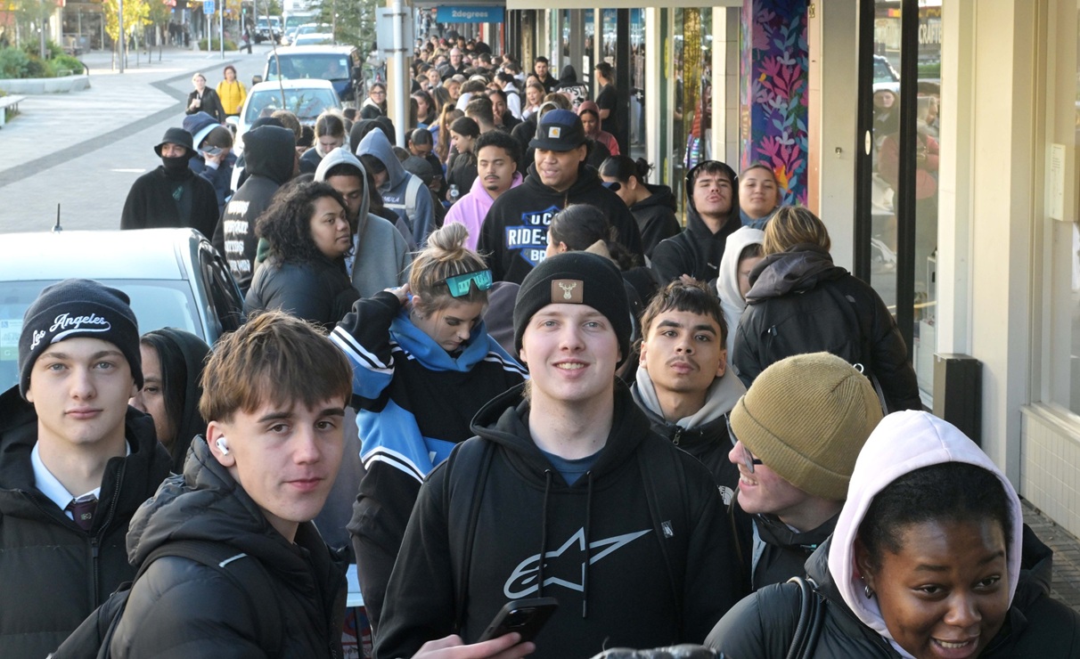 About 200 people queue at 9am yesterday for the opening of the new shop.
