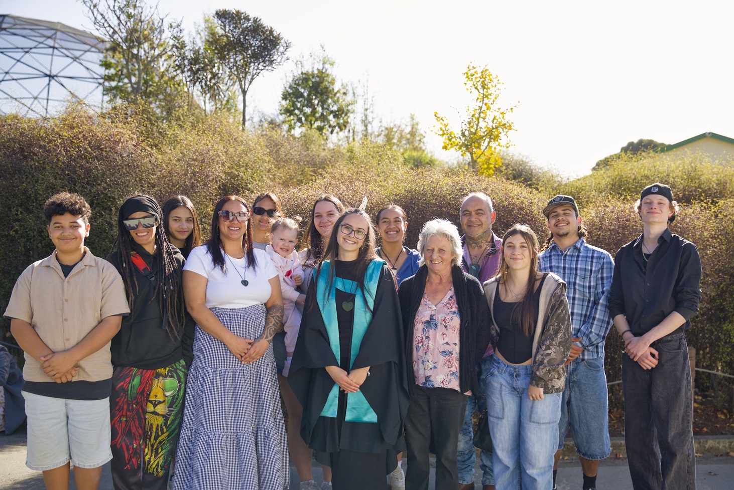 Janaya Smith-Allan surrounded by her wider whānau and supporters at Ara’s Timaru Graduation.

