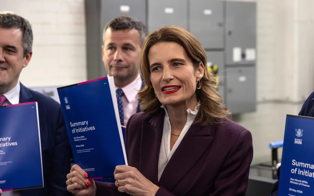 Finance Minister Nicola Willis shows off Budget 2026 ahead of its delivery on Thursday. Photo: RNZ