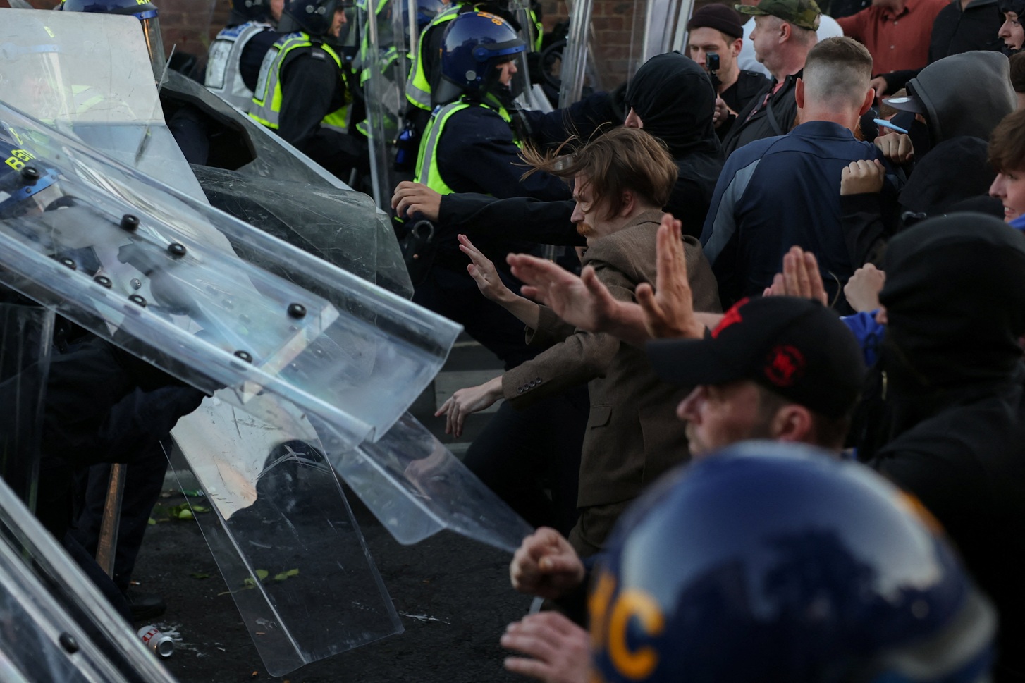 Protesters clash with police officers during a demonstration in Southampton following the...