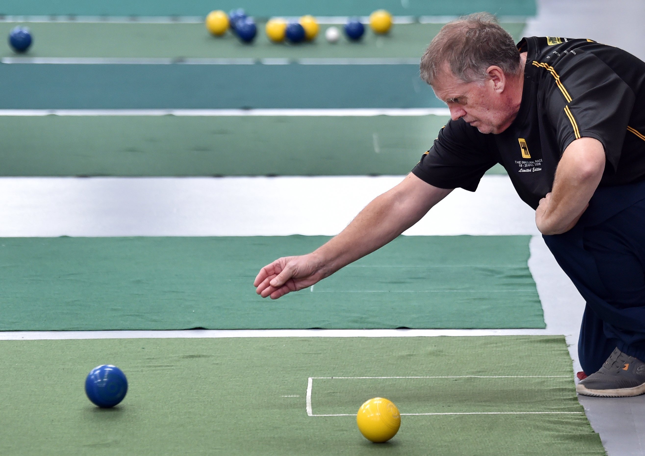 Ashburton bowler Russell Ellis sends one down during the South Island championships in Dunedin on...