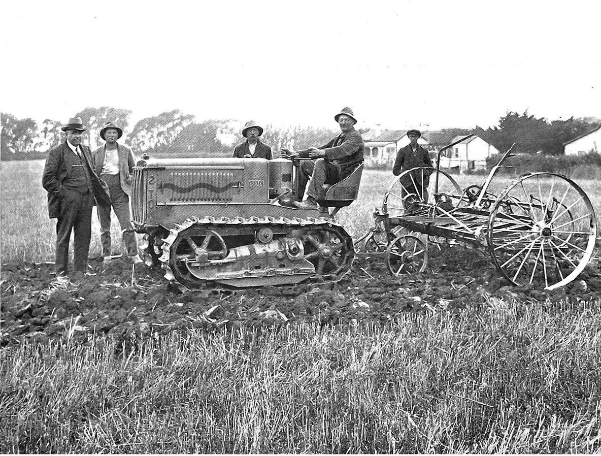 Holt 2-ton Caterpillar at work on H. Voss's farm, Willowbridge, hauling a 17-tine cultivator. —...