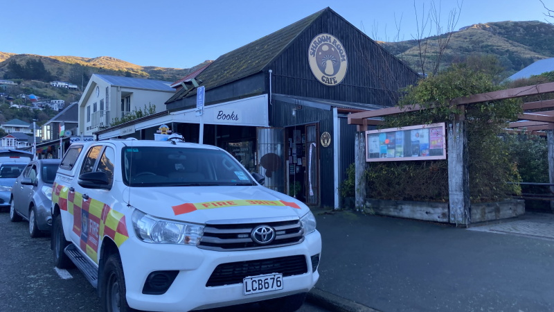 Fire and Emergency staff attend the fire at The Shroom Room in Lyttelton. Photo: Geoff Sloan