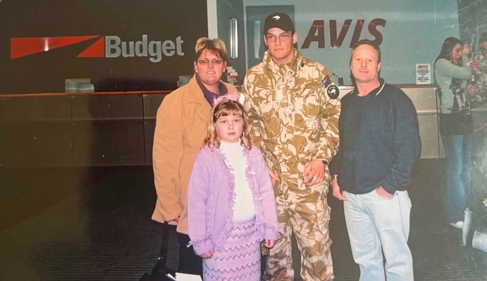 Brad Poulter in desert uniform at Christchurch Airport saying farewell to his mother Trish Harris...