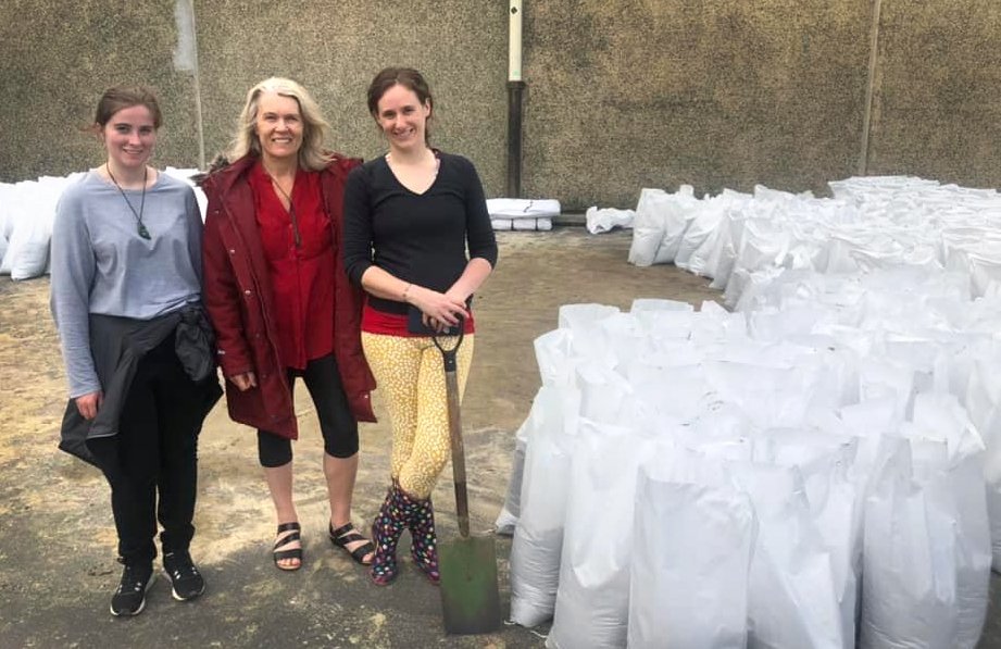 Sandbagging in South Dunedin during a 2021 flood alert (from left) Larissa McStay, Ingrid Leary...