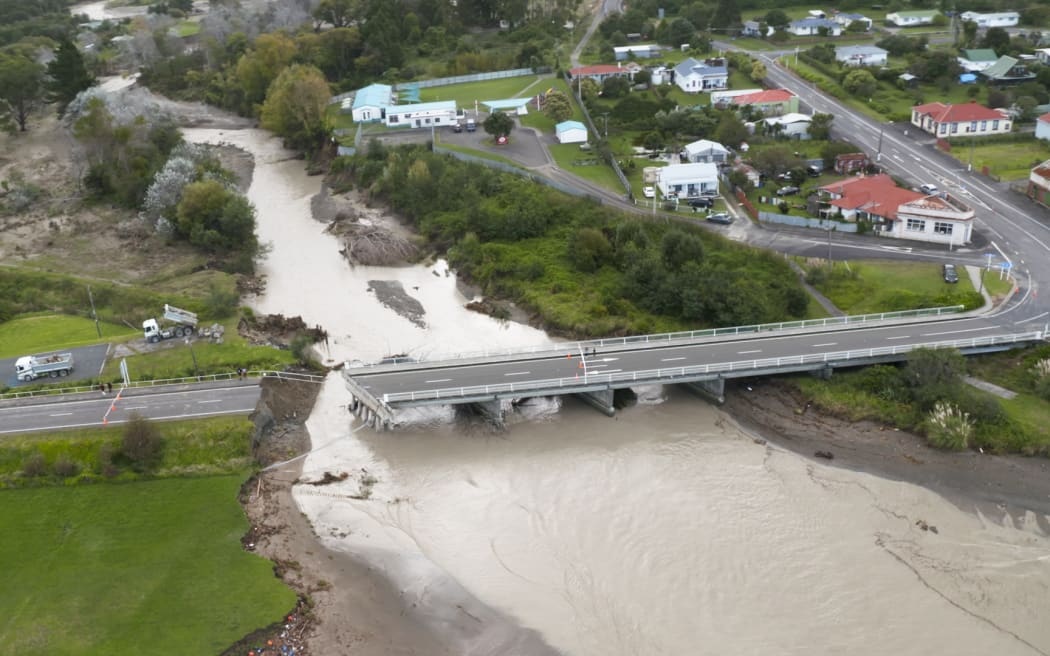 Floodwaters took out a section of Tokomaru Bay bridge in 2022, during one of many severe weather...