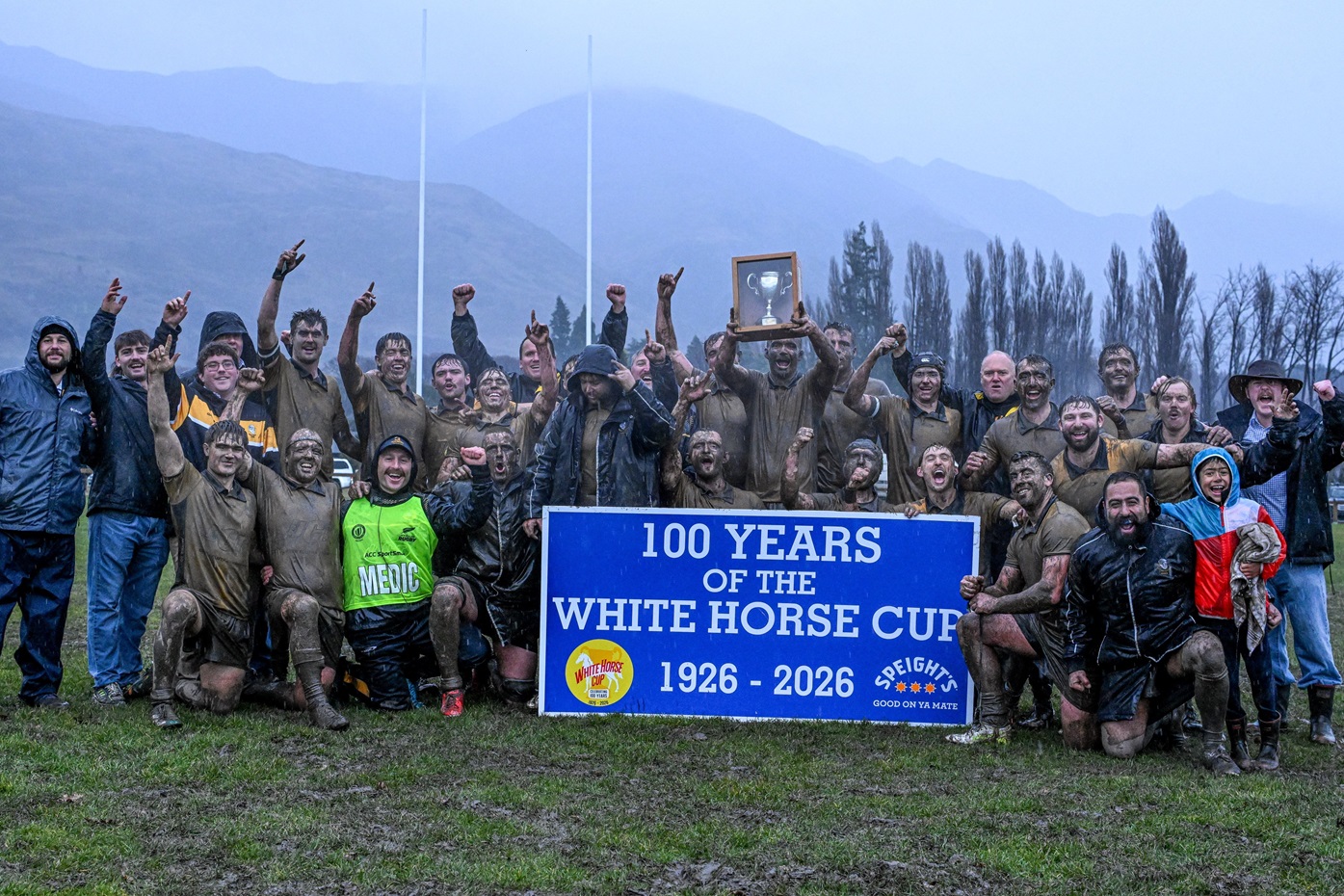 The Upper Clutha Rams celebrate a muddy 37- 7 win against the undefeated Cromwell Goats on...