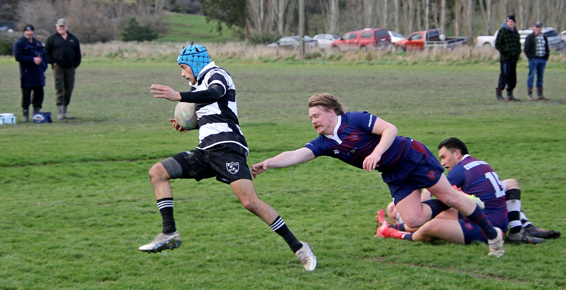 Crescent’s Mananui Keane lunges clear of Levi Devlin’s reach to place the first try of their home...