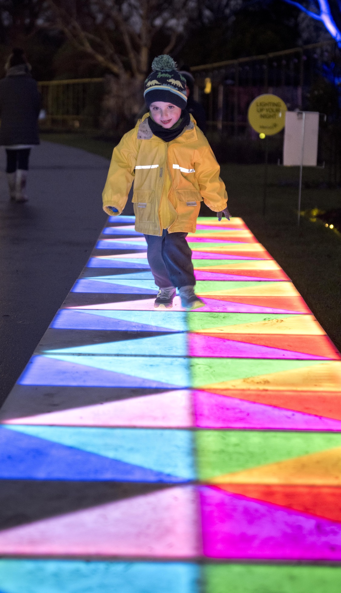 Nikau Harris, 4, of Clinton strides along a pathway pulsing in colour. Photo: Gerard O'Brien