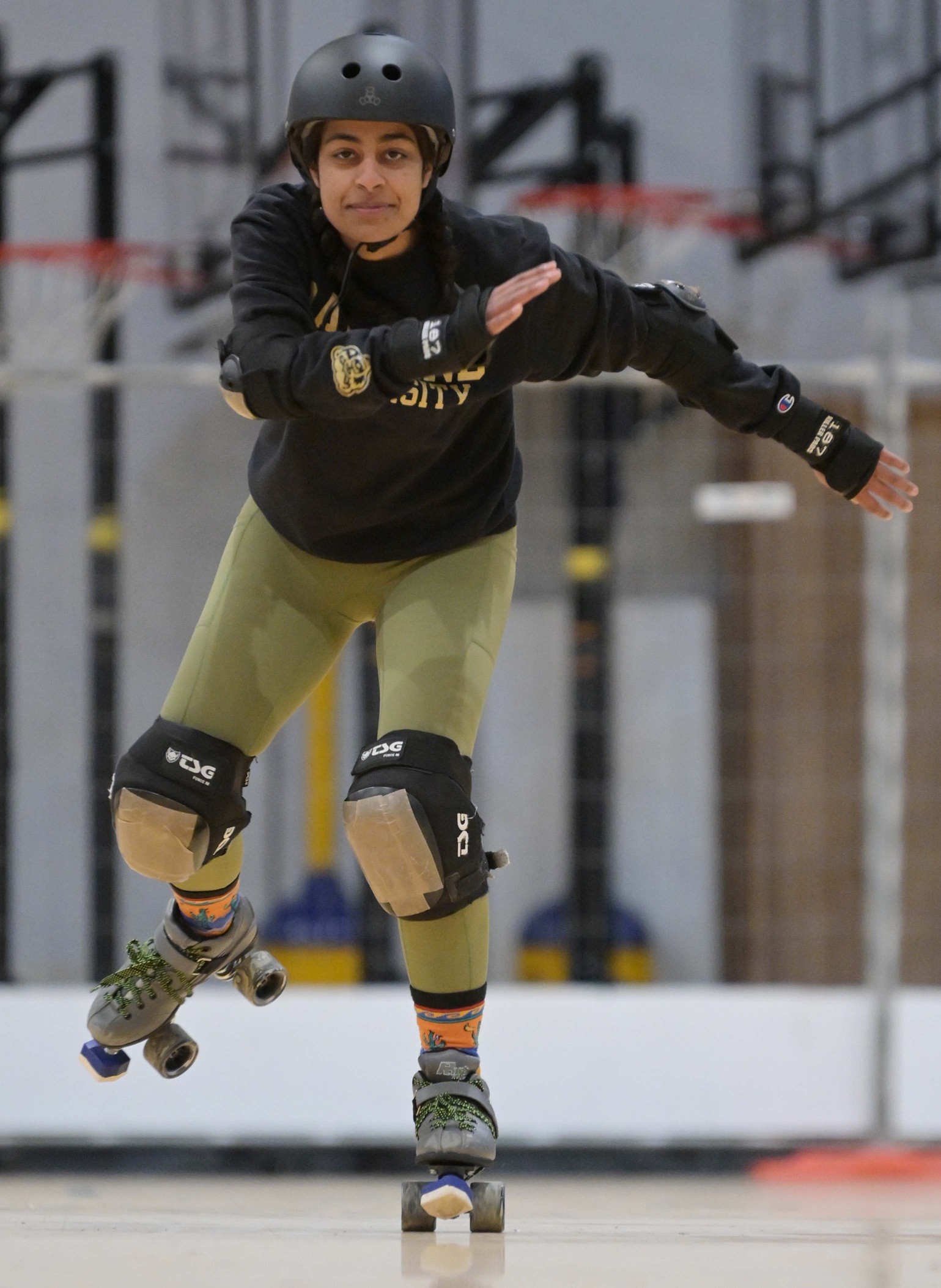 Dunedin Derby learn-to-skate graduate Bushra Varachia tests her skills at roller derby on Saturday. 