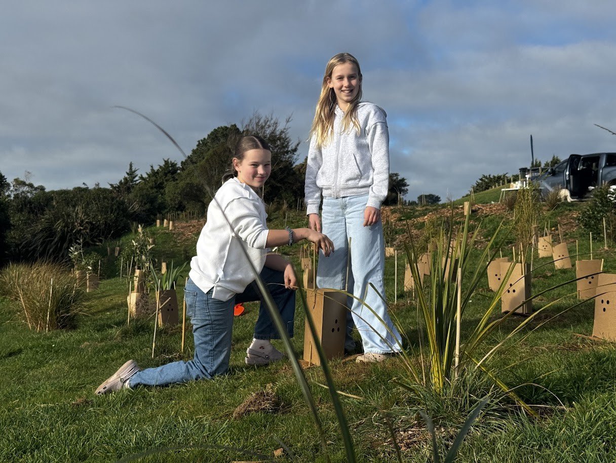 Young volunteers Poppy Waldron (kneeling at left), 11, and Lucia Wellington, 11. Photo: Rick...