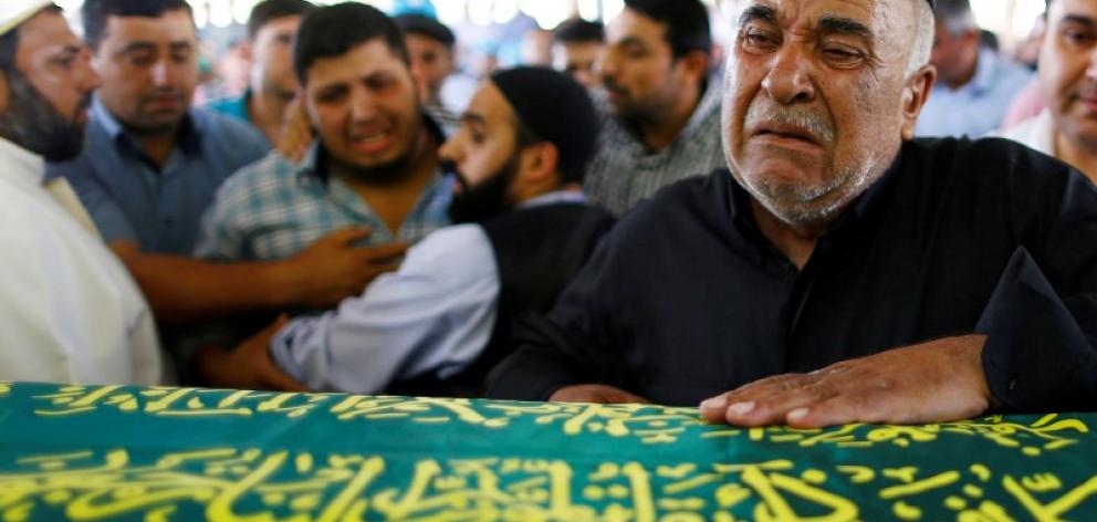 Relatives at the funeral of Kumri Ilter, who died at the wedding in Gaziantep. Photo: Reuters