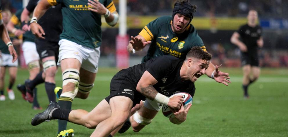 TJ Perenara dives over to score for the All Blacks. Photo Reuters