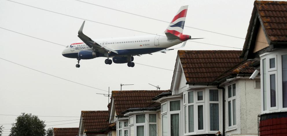 An aircraft comes in to land at Heathrow airport in west London. Photo: Reuters