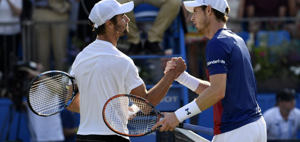 Jordan Thompson (left) is congratulated by Andy Murray. Photo: Action Images via Reuters 