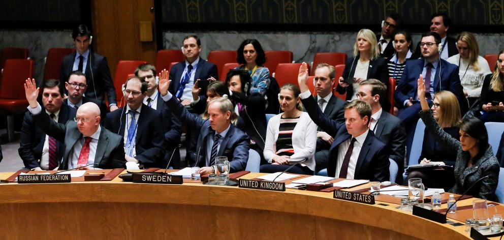 Members of the United Nations Security Council vote for a ceasefire to Syrian bombing in eastern...