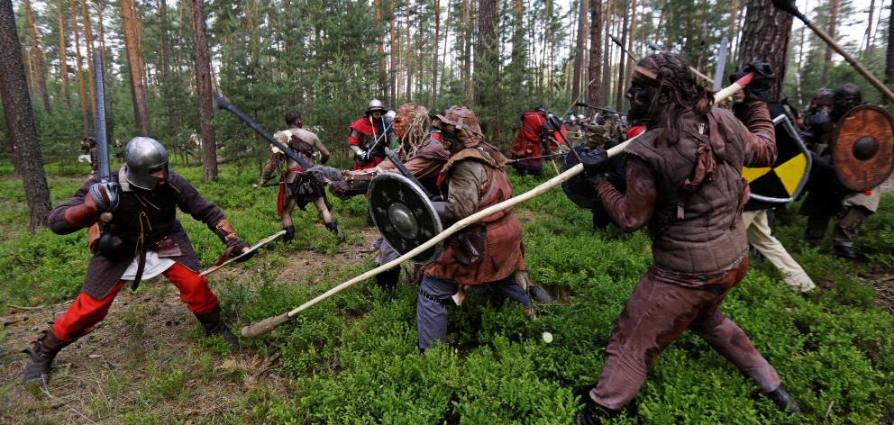 Participants in the Tolkien-themed battle in a forest near the town of Doksy, Czech Republic....