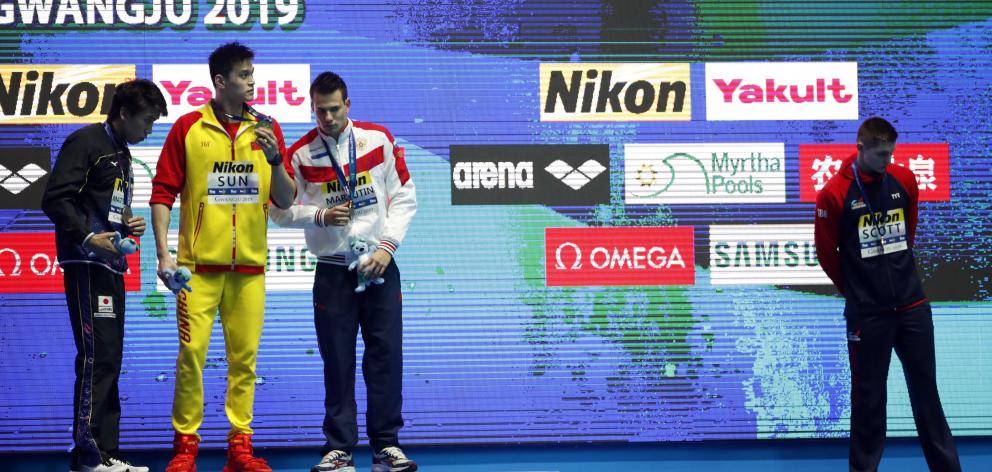 Bronze medallist Duncan Scott distanced himself from Sun Yang by not standing on the podium....